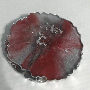 Red, while, silver and black resin coaster set.